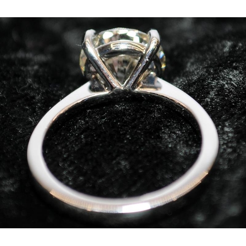 28 - A Platinum diamond solitaire ring, size K, approx. just over 3ct, colour M Clarity VVS2. Buyers comm... 