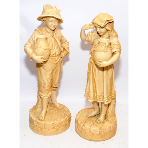 8 - Pair of Robinson & Leadbetter Ivory Parian ware figures of a peasant boy and girl carrying water ewe... 