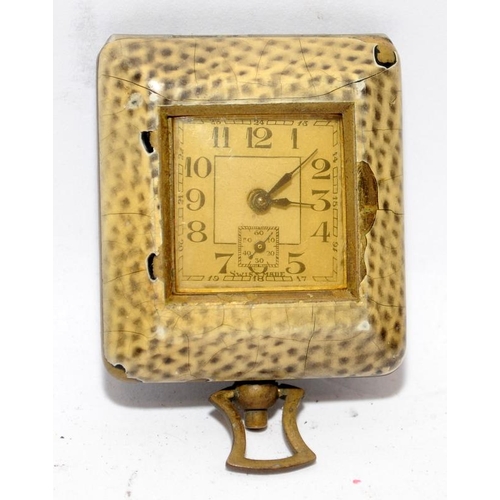 310 - Miniature 1930's manual wind folding travel clock, 4cms across not including winder. Winds and ticks... 