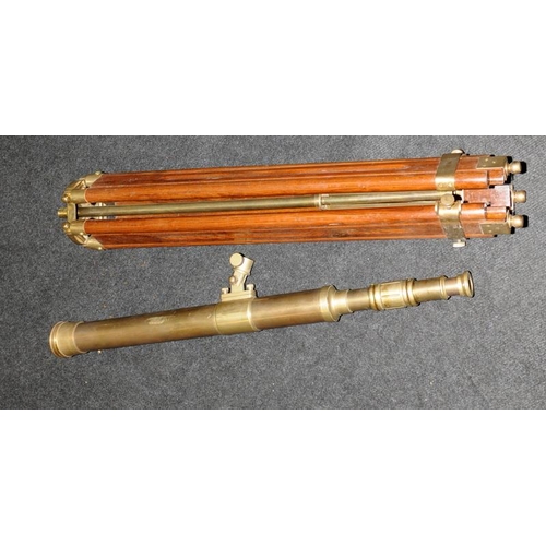 286 - Large brass telescope on adjustable brass and wood tripod base. O/all length of telescope 73cms