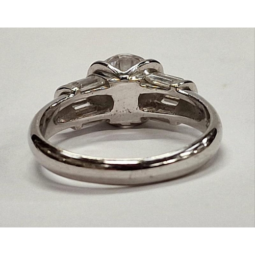 308 - 925 silver ring with central stone and baguette cut shoulders. Size O.