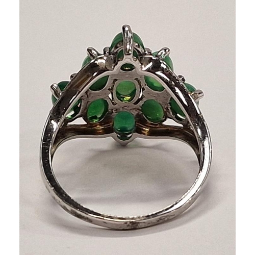 328 - 925 Silver ring of 9 green stones in diamond shape.