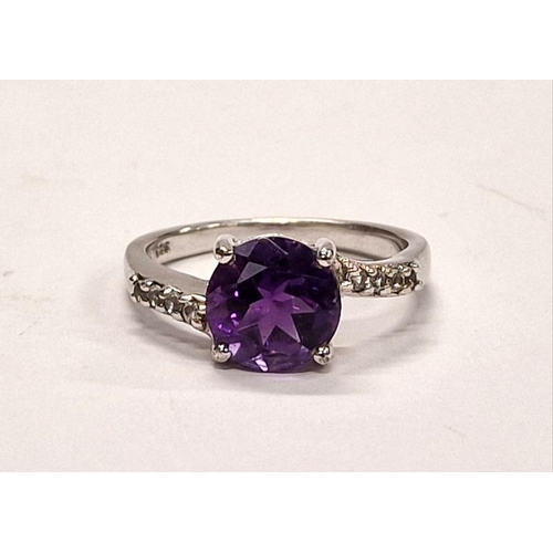 316 - 925 silver ring with central purple stone and CZ shoulders. Size P.