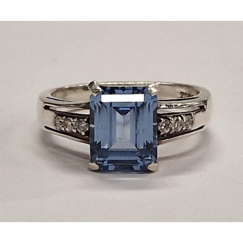 398 - 925 silver Ring with emerald cut blue stone. Size M.