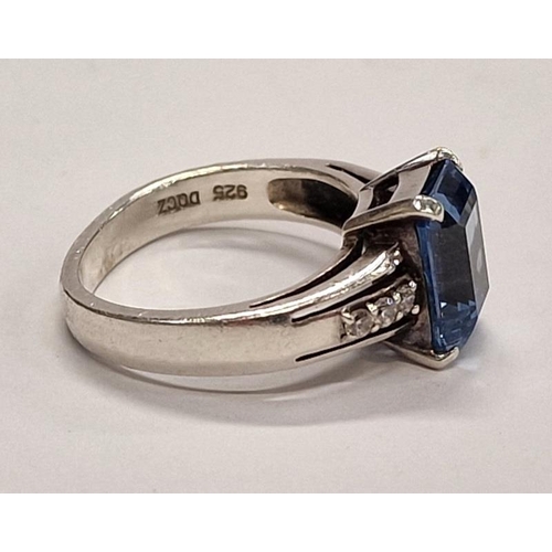 398 - 925 silver Ring with emerald cut blue stone. Size M.