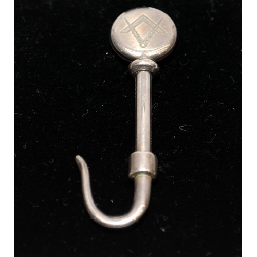 496 - Hallmarked silver Masonic napkin hook, 5.5cms across