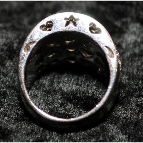 361 - A 925 silver and CZ ring with pierced decoration Size N+