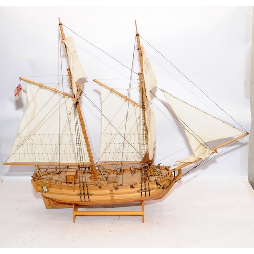 24 - Two large twin masted model sailing ships with sails and rigging on display stands. Length of larges... 