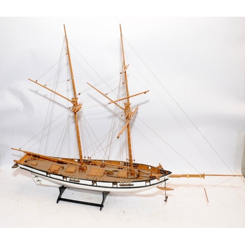 24 - Two large twin masted model sailing ships with sails and rigging on display stands. Length of larges... 