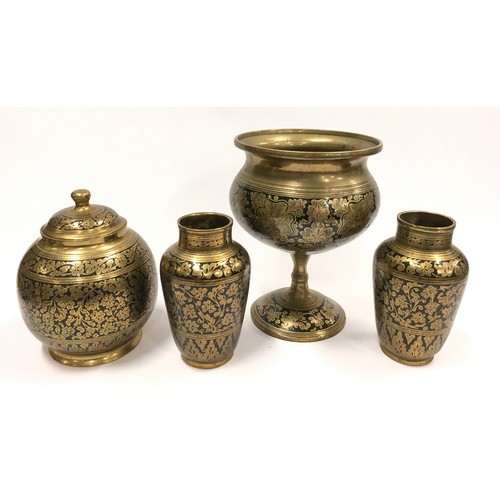 106 - A set of brass and black enamel decorative pieces (4).