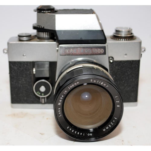 155 - Two vintage 35mm SLR cameras, an Exacta RTL with fitted Soligor 1:2.8 28mm lens, and an Olympus OM30... 