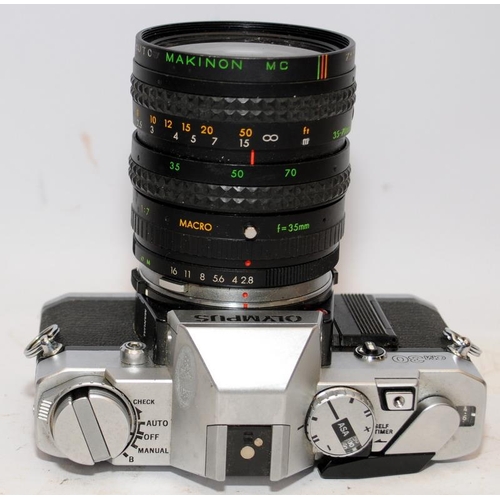 155 - Two vintage 35mm SLR cameras, an Exacta RTL with fitted Soligor 1:2.8 28mm lens, and an Olympus OM30... 