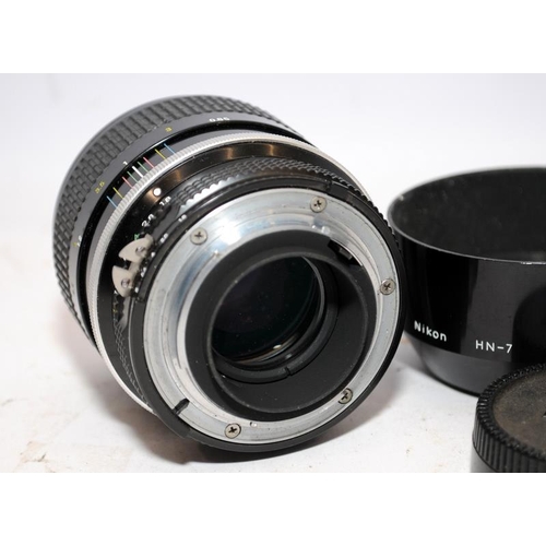 156 - Quality vintage Nikon Nikkor 1:1.8 85mm portrait lens with fitted Nikon HN7 lens hood