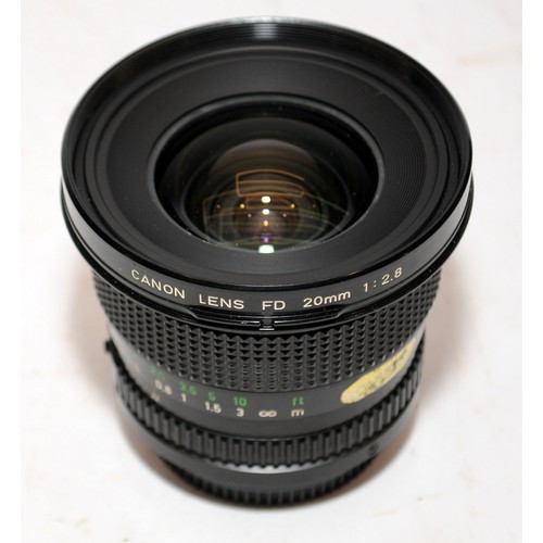 152 - Canon FD 20mm 1:2.8 wide angle lens c/w a Canon FD 135mm 1:3.5 zoom lens