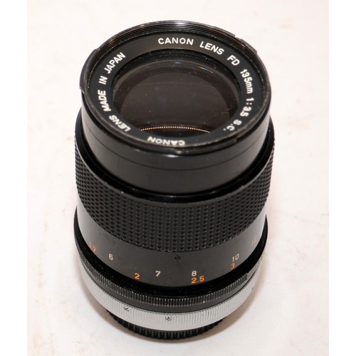 152 - Canon FD 20mm 1:2.8 wide angle lens c/w a Canon FD 135mm 1:3.5 zoom lens