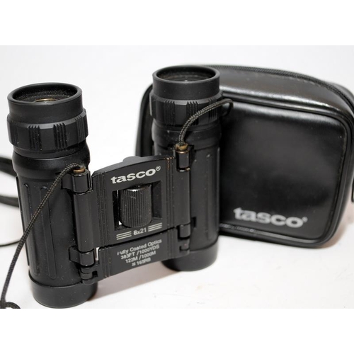 174 - Three pairs of cased compact binoculars by Tasco, Halina and Praktica