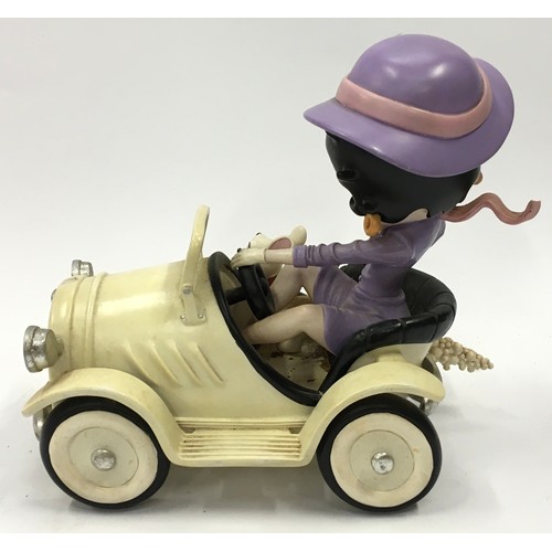 111 - Betty Boop figurine in car with dog by King Features Syndicate 2003. 23cm tall.