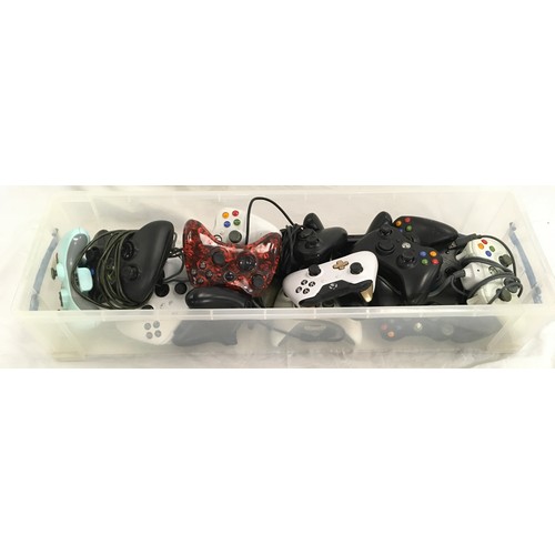 22 - A box of various Xbox gaming controllers.