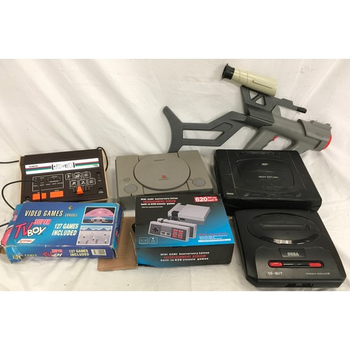 31 - Various gaming consoles to include Sega Saturn, Sega Mega Drive II, Adman Grandstand and PlayStation... 