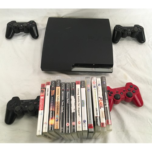 50 - A PS3 console with controllers and games.