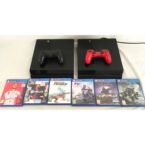 49 - Two PS4 consoles together with controllers and games.