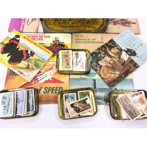 81 - Tin of vintage cigarette/tea cards loose and in albums to include Brooke Bond and Player's examples.