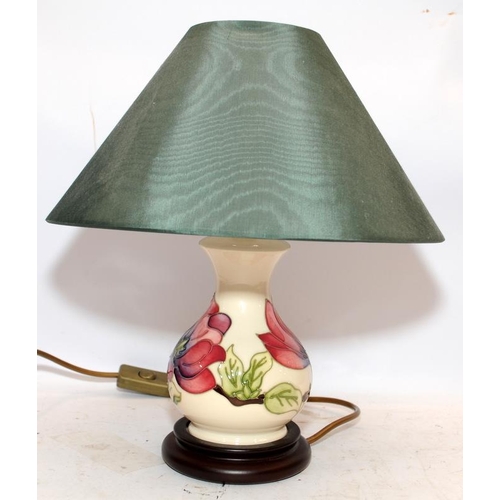 10A - Small Moorcroft table lamp c/w shade in the Magnolia pattern. 34cms tall including shade