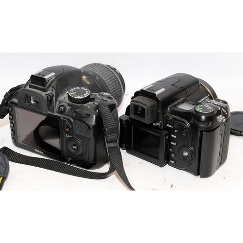 179 - Nikon Coolpix 8800 digital camera c /w a NikonD3100 DSLR with 18-55mm kit lens fitted. Both missing ... 