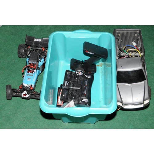 45 - Two remote controlled vehicles with controllers.