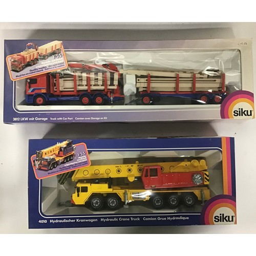 9 - Siku boxed group to include 4016 Low Loader with Space Shuttle, 3812 Truck with Car Port and 4010 Hy... 