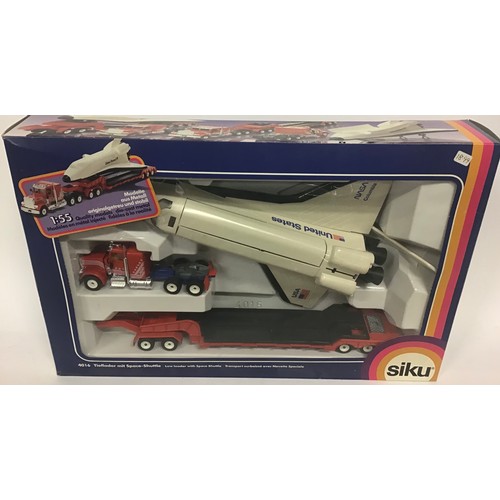 9 - Siku boxed group to include 4016 Low Loader with Space Shuttle, 3812 Truck with Car Port and 4010 Hy... 