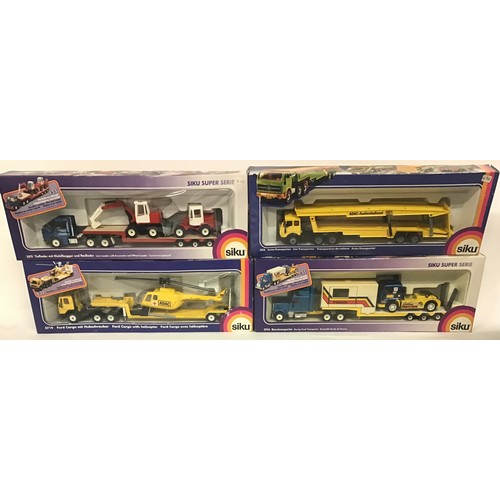 17 - Siku boxed group to include 3914 Racing Truck Transporter, 3911 Low Loader with Excavator and Wheel ... 