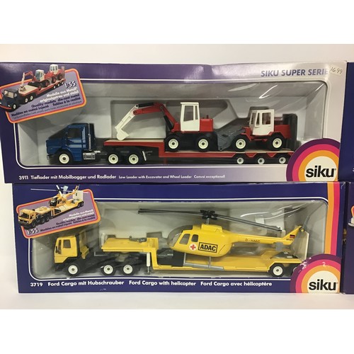 17 - Siku boxed group to include 3914 Racing Truck Transporter, 3911 Low Loader with Excavator and Wheel ... 