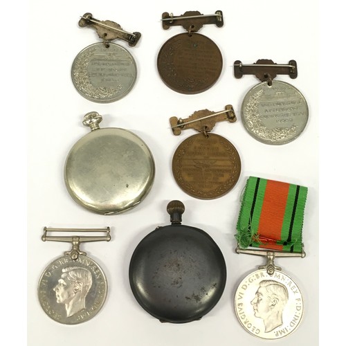 108 - Tin of military medals together with two pocket watches.