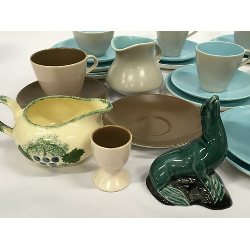 116 - Collection of Poole Pottery to include twin tone cups and saucers, Seal and Dorset fruits milk jug.