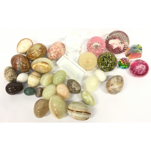 126 - Collection of glass paperweights together with a large collection of marble eggs.