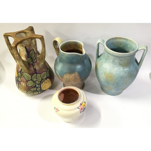 133 - collection of three vintage pottery jugs together with a Poole Pottery traditional pattern vase (4).