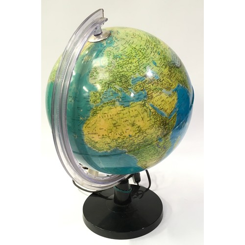 136 - An illuminated world globe of the world 82cm diameter 43cm tall.