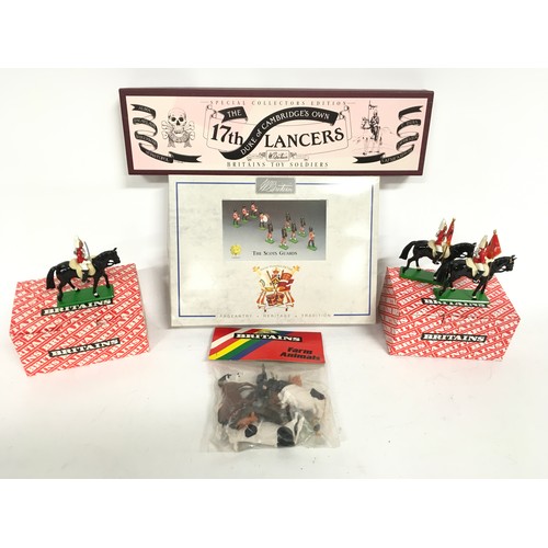 163 - Britains group to include 8305 Scots Guard 10 Piece band set, 8806 17th Lancer set and 3 mounted lif... 