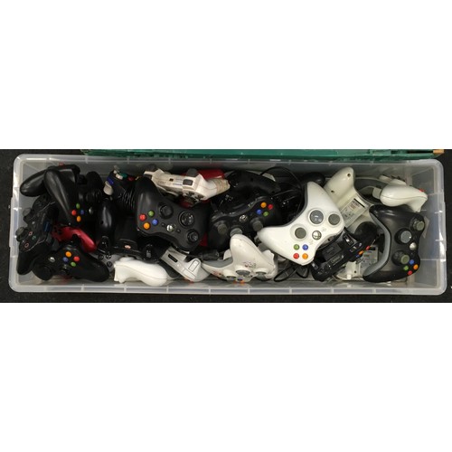 174 - A collection of Xbox and Playstation controls.