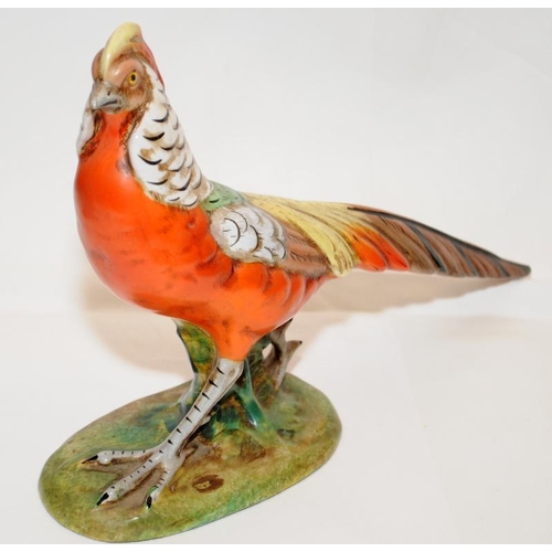 266 - A pair of quality early 20thC Italian pottery hand painted pheasants. Approx 28cms across