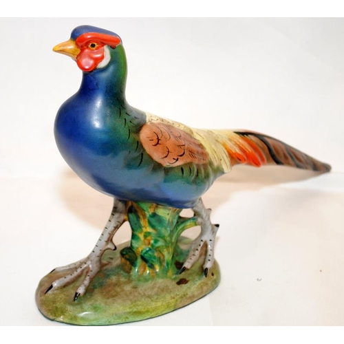 266 - A pair of quality early 20thC Italian pottery hand painted pheasants. Approx 28cms across