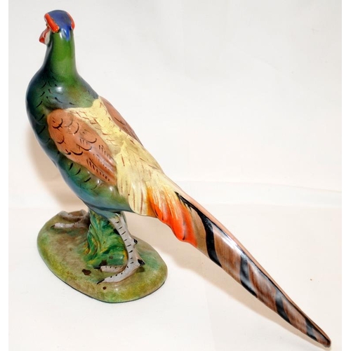 266 - A pair of quality early 20thC Italian pottery hand painted pheasants. Approx 28cms across