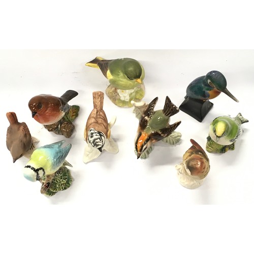 303 - A collection of Beswick and Geobel ceramic bird figurines (9).