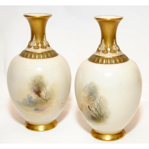 273 - Pair of antique small Royal Worcester blush ivory vases with gilded accents featuring hand painted p... 