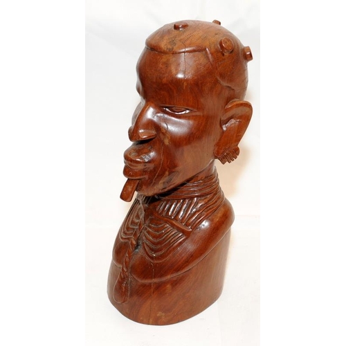 284 - Large and heavy African art wooden carved bust. 32cms tall