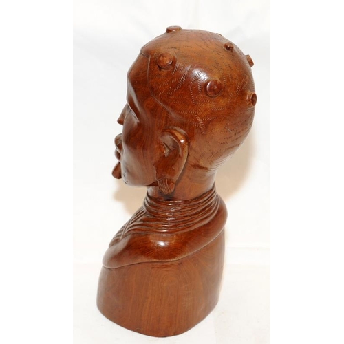 284 - Large and heavy African art wooden carved bust. 32cms tall