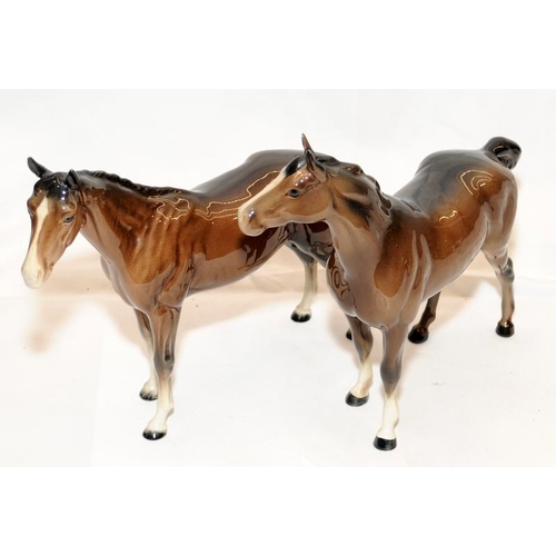 290 - Pair of opposite facing Beswick  glossy chestnut horses, 21cms tall