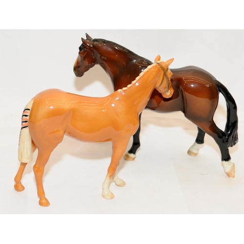 294 - Beswick glossy horses, a chestnut and a Palomino, 16cms tall.