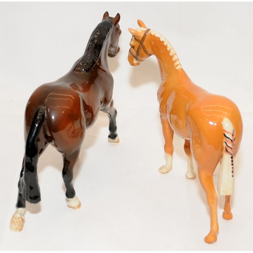 294 - Beswick glossy horses, a chestnut and a Palomino, 16cms tall.